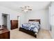 Spacious bedroom with a queen-sized bed, a ceiling fan, a window, and a closet with open door at 405 Watershed Dr Dr, Goose Creek, SC 29445