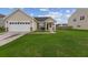 Inviting home exterior features a green lawn and a convenient attached two-car garage at 405 Watershed Dr Dr, Goose Creek, SC 29445
