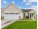 Charming single-story home boasts a well-manicured lawn and inviting curb appeal at 405 Watershed Dr Dr, Goose Creek, SC 29445
