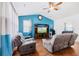 Cozy living room features comfortable seating, a ceiling fan, and a stylish entertainment center at 405 Watershed Dr Dr, Goose Creek, SC 29445