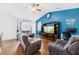 Cozy living room has comfortable seating and a large entertainment center at 405 Watershed Dr Dr, Goose Creek, SC 29445