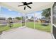 Covered back patio with a ceiling fan, a view of the backyard, a barbecue and a trampoline at 405 Watershed Dr Dr, Goose Creek, SC 29445