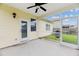 Covered back patio with a ceiling fan, a white door, and a view of the backyard at 405 Watershed Dr Dr, Goose Creek, SC 29445