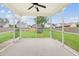 Covered back patio with a view of the backyard, a wooden fence and houses nearby at 405 Watershed Dr Dr, Goose Creek, SC 29445