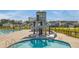 Community pool featuring a fun slide and a water tower, set against a backdrop of beautiful homes at 444 Cedarview Rd, Summerville, SC 29486