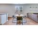 Open dining area with a round table, modern chairs, and a view to the kitchen and living room at 444 Cedarview Rd, Summerville, SC 29486