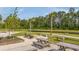 Community fire pit and picnic area surrounded by green space, perfect for gatherings and relaxation at 444 Cedarview Rd, Summerville, SC 29486