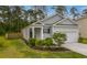 Charming single-story home with well-manicured landscaping and an attached one car garage at 444 Cedarview Rd, Summerville, SC 29486