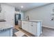 Kitchen island featuring granite countertops, white cabinetry, stainless steel appliances, and wood-look flooring at 444 Cedarview Rd, Summerville, SC 29486