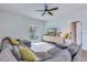 Sun-filled living room with a large sectional sofa, modern media cabinet and access to the backyard at 444 Cedarview Rd, Summerville, SC 29486