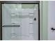 Modern shower with sleek glass doors, built-in shelving, and stylish hardware at 444 Cedarview Rd, Summerville, SC 29486