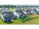 Aerial view of the home's backyard, featuring a fenced-in yard with a playground set at 447 Navona Dr, Summerville, SC 29486