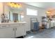 Bright bathroom with double vanity, modern lighting, a window, and ample storage space at 447 Navona Dr, Summerville, SC 29486