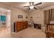 Bedroom with wood dresser, mounted fan, and neutral carpet at 447 Navona Dr, Summerville, SC 29486
