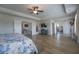 Bright primary bedroom with hardwood floors featuring multiple doorways at 447 Navona Dr, Summerville, SC 29486