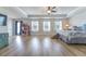 Large primary bedroom with tray ceiling, plush bed and view to back yard at 447 Navona Dr, Summerville, SC 29486