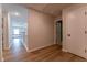 Upstairs hallway with hardwood floors, white doors, and good lighting at 447 Navona Dr, Summerville, SC 29486