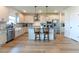 Bright, modern kitchen with white cabinets, a central island, and stainless steel appliances at 447 Navona Dr, Summerville, SC 29486