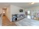 Bright playroom with a TV, toy kitchen, storage shelves, and light blue rug at 447 Navona Dr, Summerville, SC 29486