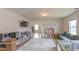 Upstairs playroom with a cozy couch, cloud rug, and shelves stocked with toys at 447 Navona Dr, Summerville, SC 29486