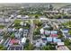Aerial shot showcases a neighborhood with various roof colors, mature trees, and streetscapes at 48 Aiken St, Charleston, SC 29403