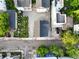 Aerial view of residential homes showcasing backyards, roof styles, and a neighborhood street at 48 Aiken St, Charleston, SC 29403