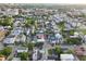 Aerial view of charming neighborhood with trees, diverse architecture, and orderly street layout at 48 Aiken St, Charleston, SC 29403