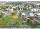 Expansive aerial view showcases community amenities including pool, park, baseball field, basketball courts and city views at 48 Aiken St, Charleston, SC 29403