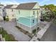 Aerial view of a charming two-story home, a two-car garage, and private parking area at 48 Aiken St, Charleston, SC 29403