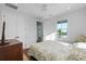 Bright bedroom features a ceiling fan, ensuite bath, and natural light from the single hung window at 48 Aiken St, Charleston, SC 29403