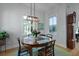 Bright dining area with round table, stylish chairs, and natural light; perfect for Gathering meals at 48 Aiken St, Charleston, SC 29403