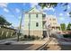 Charming home exterior with double balconies, two-car garage and landscaped front at 48 Aiken St, Charleston, SC 29403