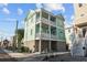 Beautiful home exterior with balconies, featuring a two-car garage and well-kept landscaping at 48 Aiken St, Charleston, SC 29403