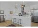 Well-equipped kitchen with stainless appliances, breakfast bar, and modern finishes at 48 Aiken St, Charleston, SC 29403