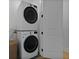 Functional laundry room with stacked washer/dryer and ample space at 48 Aiken St, Charleston, SC 29403