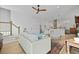 Spacious living area with hardwood floors, a ceiling fan, neutral tones and an open concept design at 48 Aiken St, Charleston, SC 29403