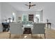 Bright and airy living room with hardwood floors, ceiling fan, neutral tones and natural light at 48 Aiken St, Charleston, SC 29403