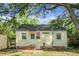 View of the back exterior of this home featuring a brick foundation and tidy backyard at 4810 Parkside Dr, North Charleston, SC 29405