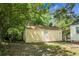 Backyard shed sitting in a shady lot at 4810 Parkside Dr, North Charleston, SC 29405