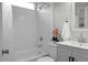 Bathroom with a white subway tile shower and tub and white vanity with a mirror at 4810 Parkside Dr, North Charleston, SC 29405
