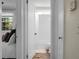 Hallway view to the bathroom with white subway tile and a separated view of a bedroom at 4810 Parkside Dr, North Charleston, SC 29405
