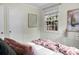 Bright bedroom with windows letting in natural light, modern decor, and cozy blankets at 4810 Parkside Dr, North Charleston, SC 29405