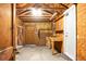 Spacious garage with exposed wooden frame, concrete floor and white garage door at 4810 Parkside Dr, North Charleston, SC 29405