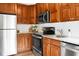 Updated kitchen boasts stainless steel appliances, granite countertops, and ample cabinet space at 4810 Parkside Dr, North Charleston, SC 29405