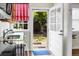 Kitchen sink and door to the backyard with beautiful outdoor views and natural lighting at 4810 Parkside Dr, North Charleston, SC 29405