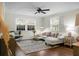 Inviting living room featuring a comfortable sectional sofa, stylish rug, and ample natural light, perfect for relaxing and entertaining at 4810 Parkside Dr, North Charleston, SC 29405