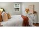 Bright main bedroom with a white comforter, decorative pillows, and a white dresser with decor at 4810 Parkside Dr, North Charleston, SC 29405