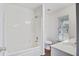Bright bathroom with tub-shower combo, white fixtures and vinyl flooring at 4818 Buttercup Way, Summerville, SC 29485
