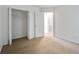 Bright bedroom featuring neutral carpet, white trim, and closet with open doors at 4818 Buttercup Way, Summerville, SC 29485