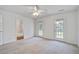 Bright bedroom with neutral carpet, ceiling fan, and access to the deck at 4818 Buttercup Way, Summerville, SC 29485